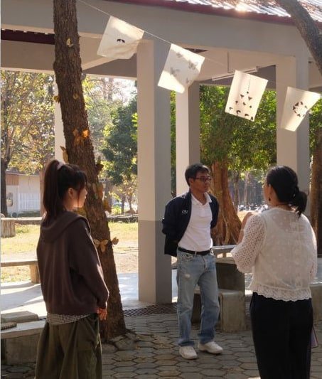 Site conversation beside the installed work.