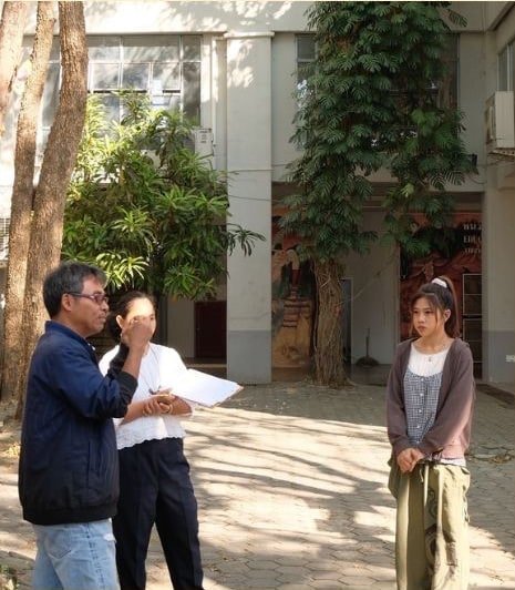 Reviewing the work in the courtyard.